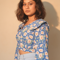 floral blue top with a statement collar detailing