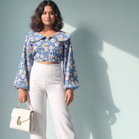 floral blue top with a statement collar detailing